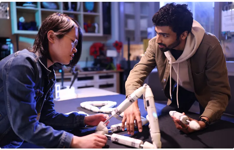 students discussing a project_photo by John Abbott